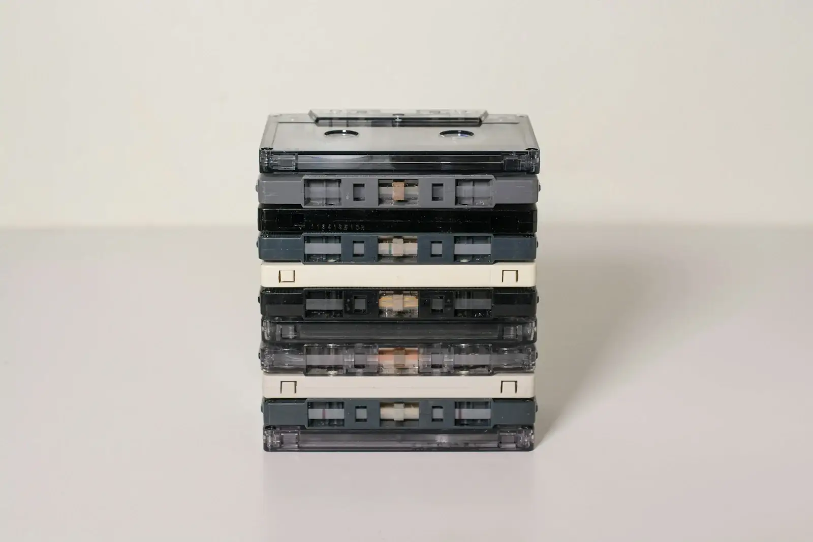 A stack of cassette tapes, a material study for the couple's mixtape